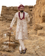 Off-White Royal Sherwani with Traditional Sehra and Red Accents