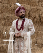 Off-White Royal Sherwani with Traditional Sehra and Red Accents