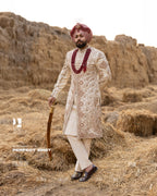 Off-White Royal Sherwani with Traditional Sehra and Red Accents