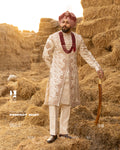Off-White Royal Sherwani with Traditional Sehra and Red Accents