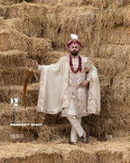 Off-White Royal Sherwani with Traditional Sehra and Red Accents