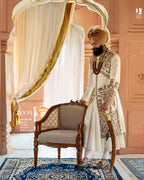 Ivory Sherwani for Grooms Featuring Antique Gold Resham and Zari Hand Embroidery