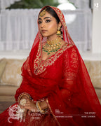Red bridal lehenga with intricate handwork and traditional dupatta