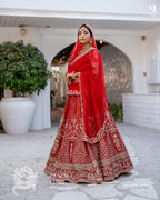 Red bridal lehenga with intricate handwork and traditional dupatta