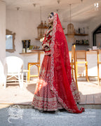 Red bridal lehenga with intricate handwork and traditional dupatta