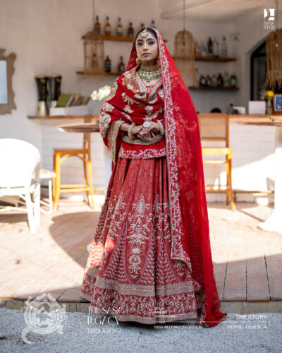 Red bridal lehenga with intricate handwork and traditional dupatta